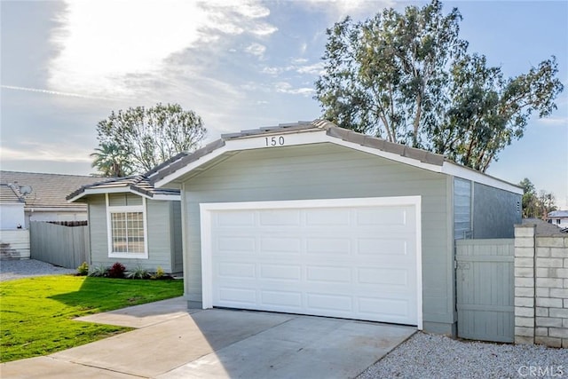 view of front of home with a front lawn and a garage