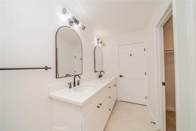 bathroom with tile patterned flooring and vanity