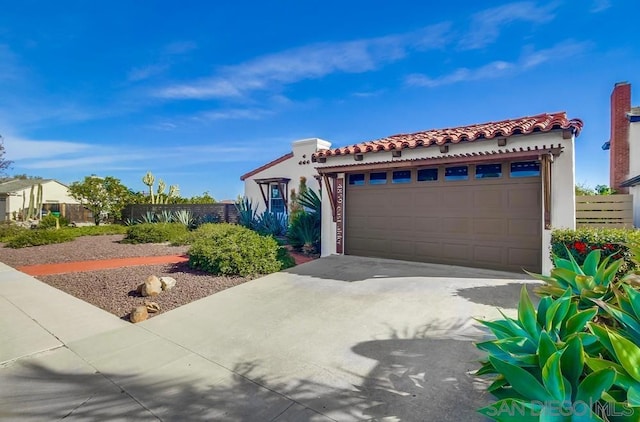 mediterranean / spanish-style house featuring a garage