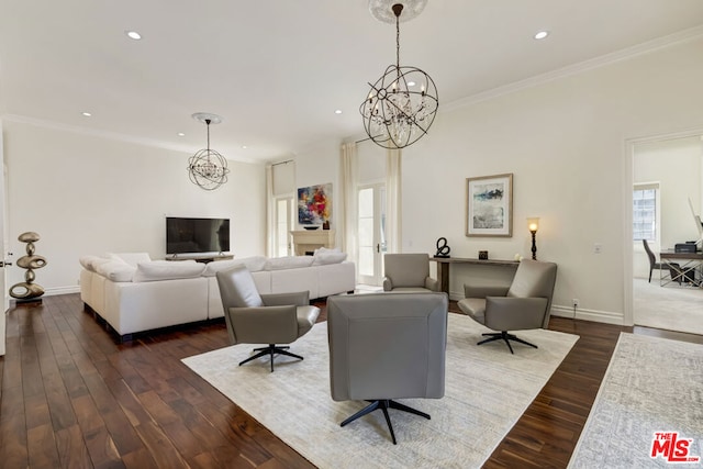 living room featuring dark hardwood / wood-style floors, crown molding, and a notable chandelier