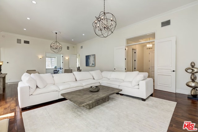 living room featuring dark hardwood / wood-style flooring and crown molding