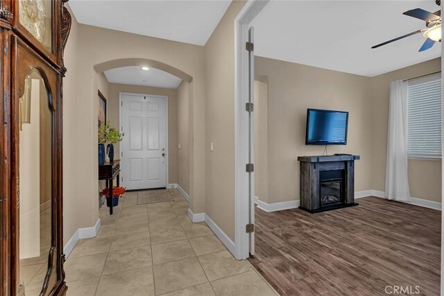 interior space with ceiling fan