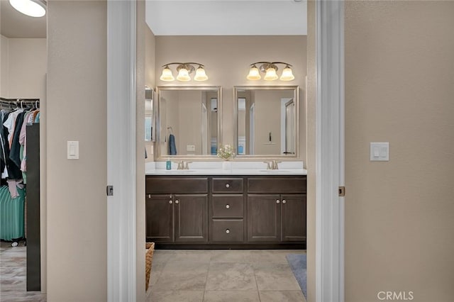 bathroom with tile patterned floors and vanity