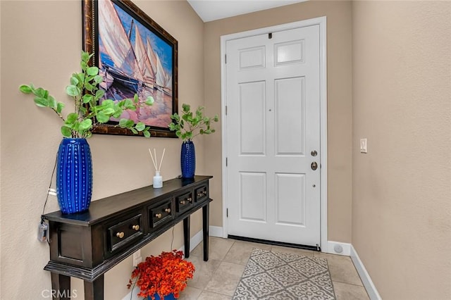 entryway with light tile patterned floors