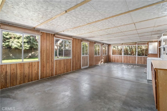 unfurnished sunroom with washer / clothes dryer