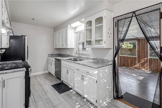 kitchen with white cabinets, appliances with stainless steel finishes, and sink