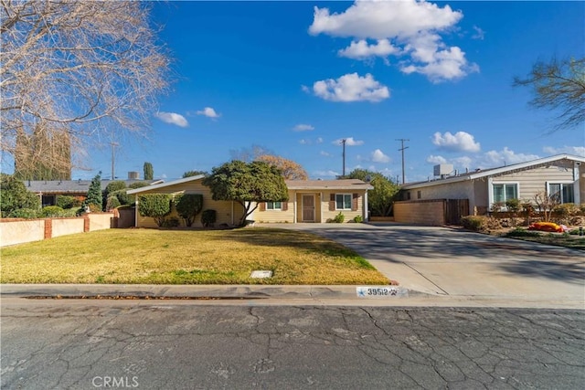 ranch-style home with a front yard