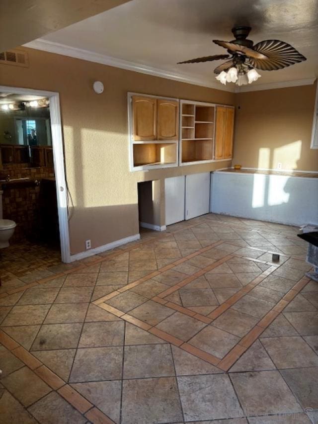 kitchen with ceiling fan and crown molding