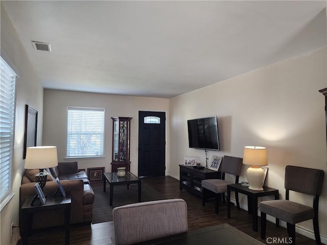 living room featuring dark hardwood / wood-style floors