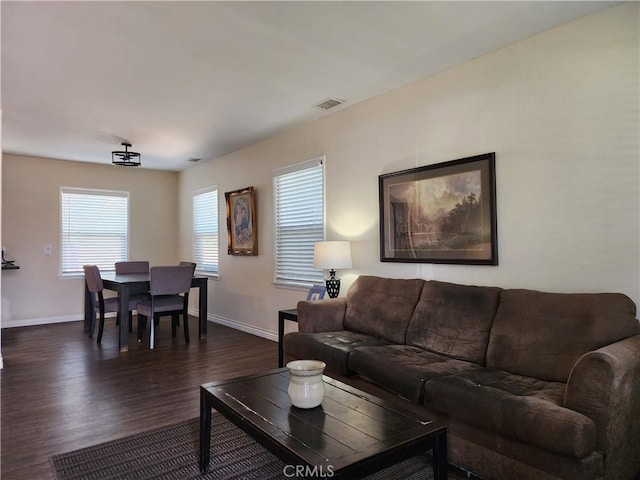 living room with dark hardwood / wood-style floors