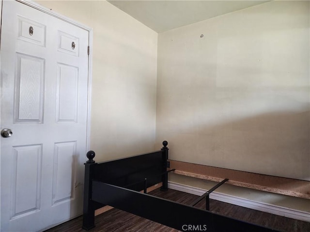 stairway with hardwood / wood-style flooring