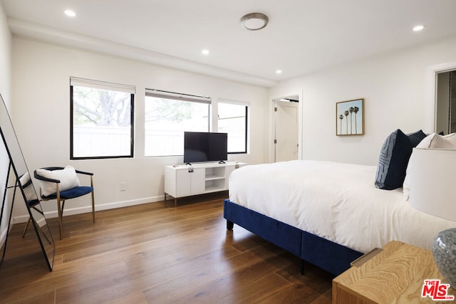 bedroom featuring dark wood-type flooring