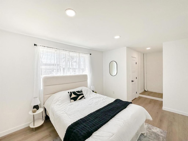 bedroom with light wood-type flooring