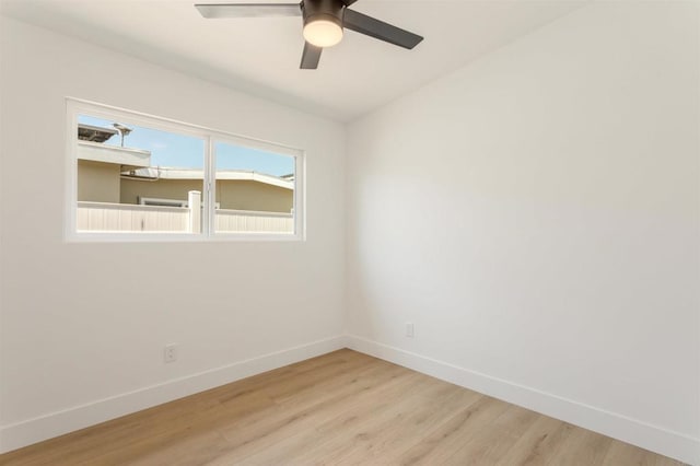 spare room featuring ceiling fan and light wood-type flooring