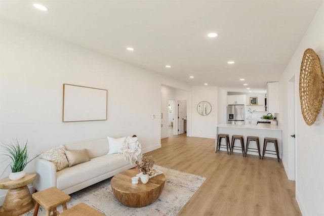 living room with light hardwood / wood-style floors