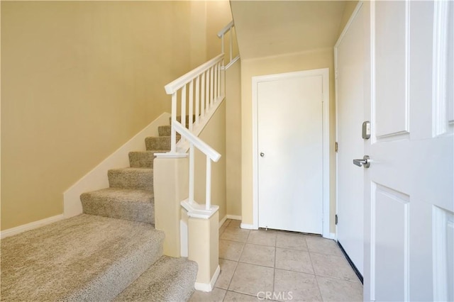 stairway featuring tile patterned floors