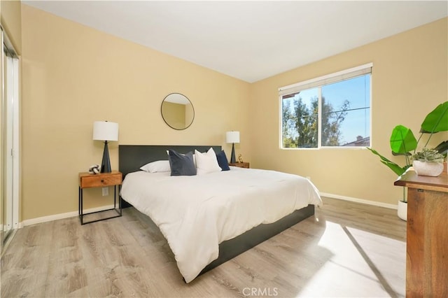 bedroom with light hardwood / wood-style flooring