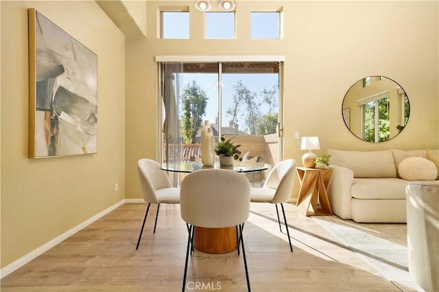 dining area with light wood-type flooring