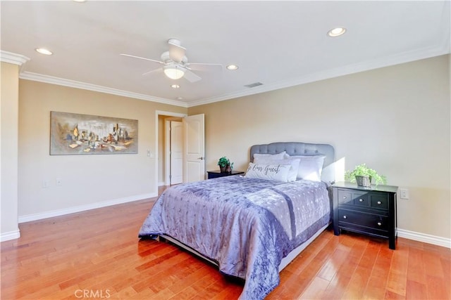 bedroom with ceiling fan, crown molding, and hardwood / wood-style floors