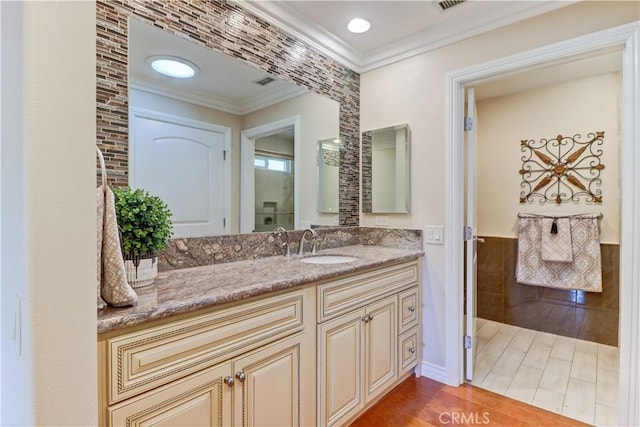 bathroom featuring vanity and crown molding