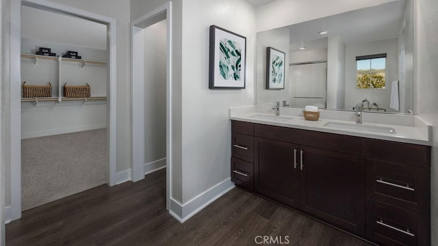 bathroom with wood-type flooring and vanity