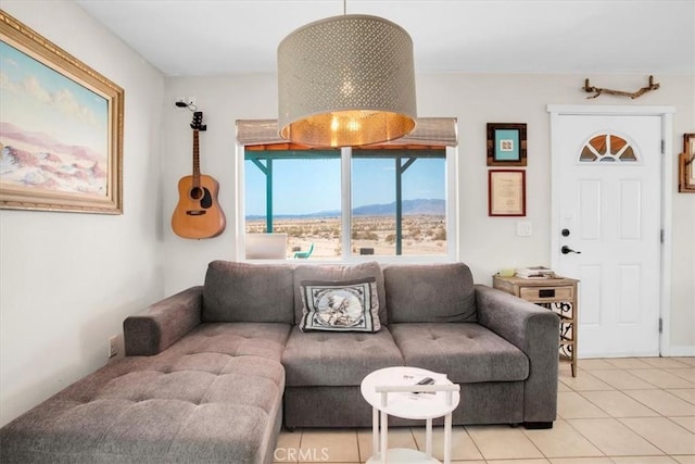 living room with light tile patterned flooring and a mountain view