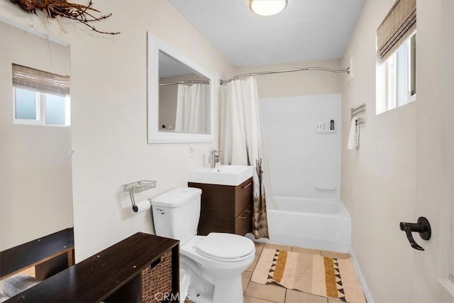 full bathroom with toilet, a healthy amount of sunlight, tile patterned flooring, and shower / bath combination with curtain