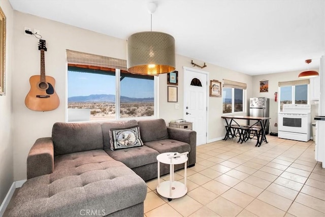 living room featuring light tile patterned flooring and a mountain view