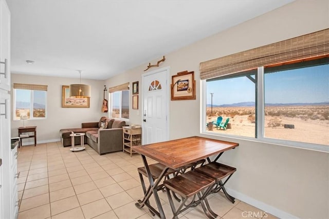 dining room featuring light tile patterned flooring