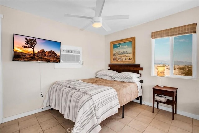 tiled bedroom featuring ceiling fan and a wall unit AC