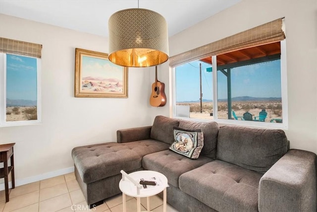 living room with light tile patterned floors and a healthy amount of sunlight