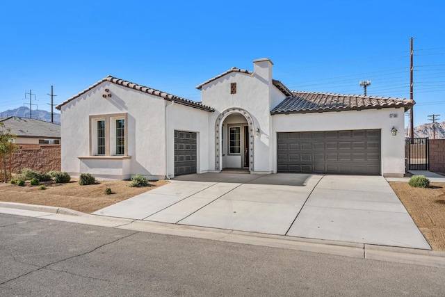 mediterranean / spanish-style home featuring a garage