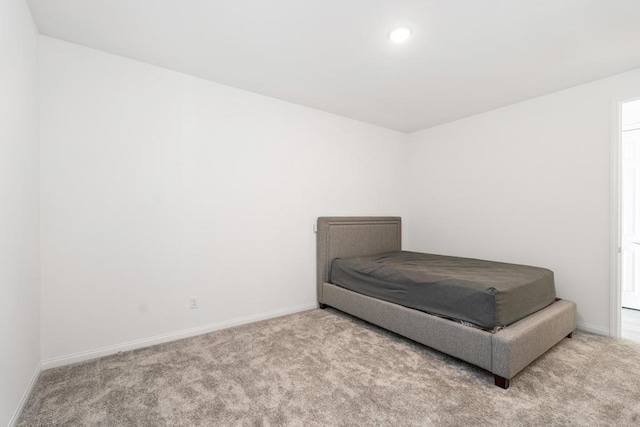 bedroom with light carpet