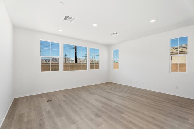 unfurnished room featuring light wood-type flooring