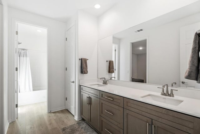 bathroom featuring vanity and wood-type flooring