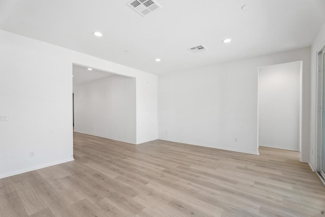 unfurnished room featuring light hardwood / wood-style floors