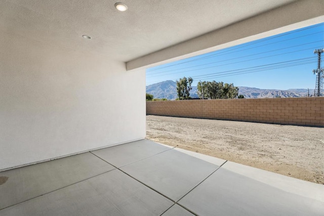 view of patio / terrace featuring a mountain view