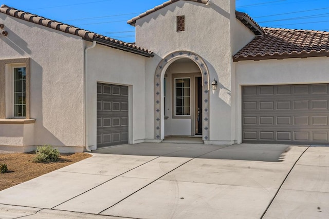 entrance to property featuring a garage