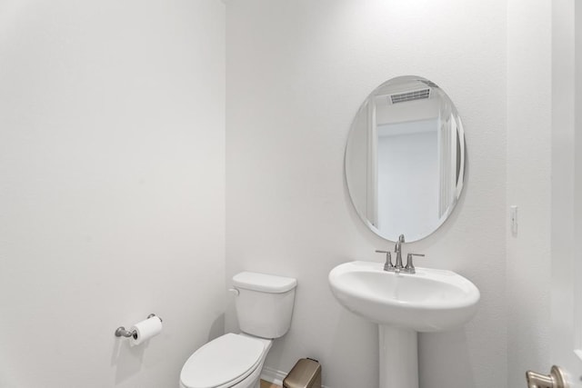 bathroom featuring toilet