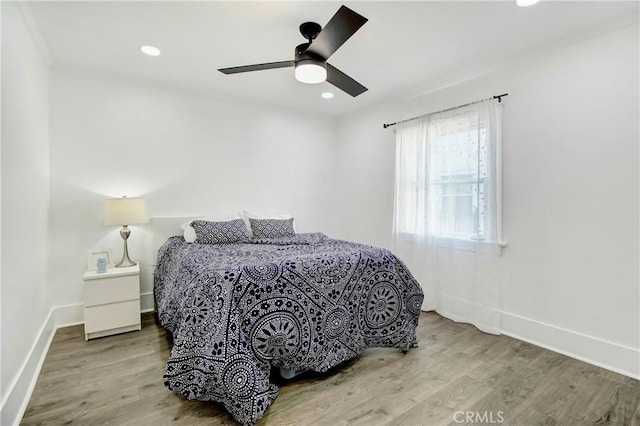 bedroom featuring ceiling fan and wood-type flooring