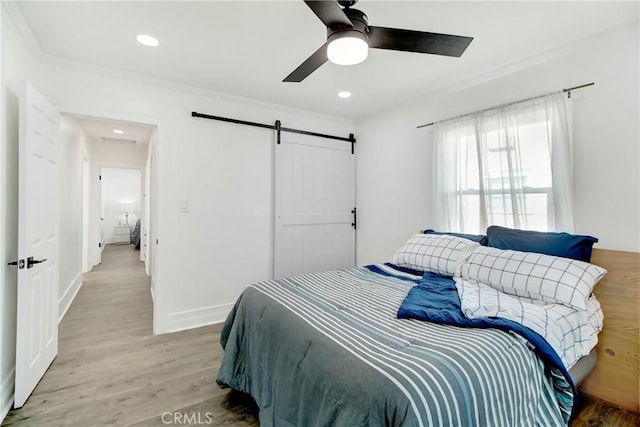 5737 5th, Los Angeles, CA 90043 - bedroom featuring a barn door, crown molding, light wood-style flooring, ceiling fan, and recessed lighting