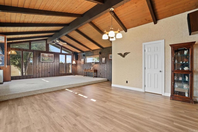 interior space with wooden ceiling, a chandelier, light hardwood / wood-style flooring, and lofted ceiling with beams