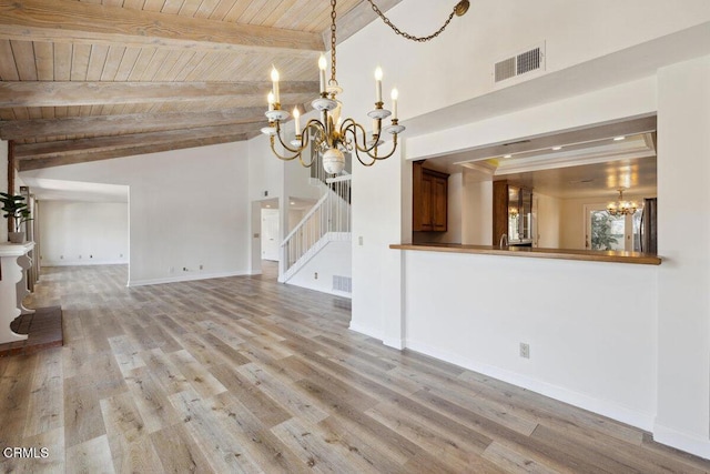interior space featuring visible vents, stairway, wood ceiling, wood finished floors, and a notable chandelier