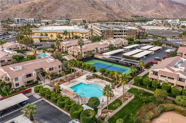 birds eye view of property with a mountain view