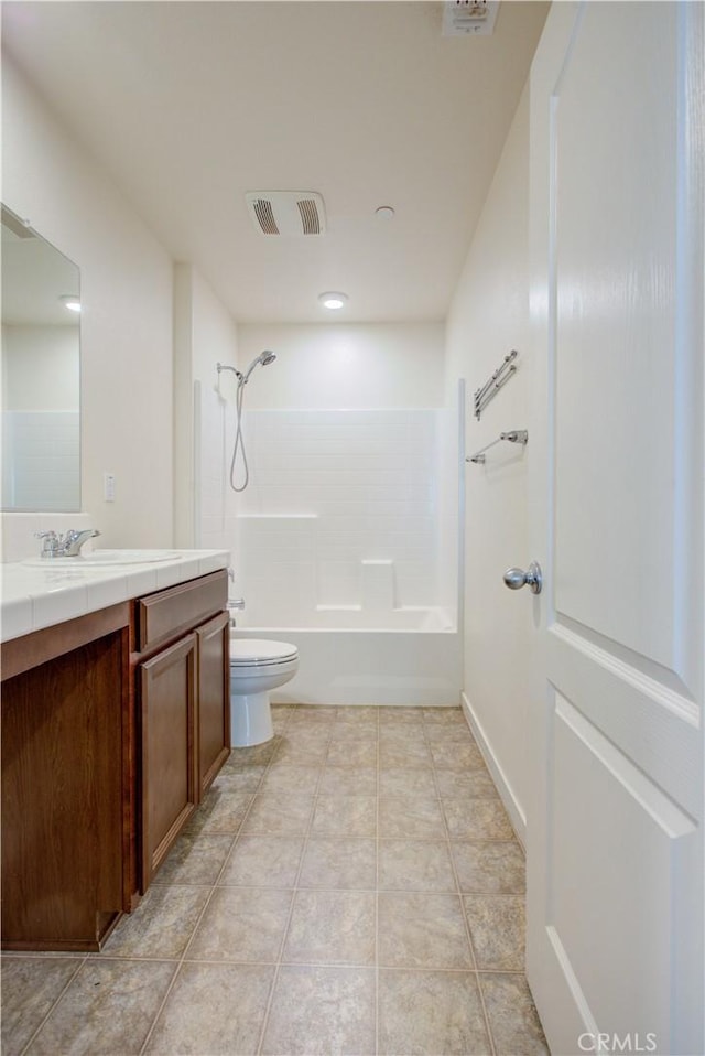 full bathroom with visible vents, toilet, washtub / shower combination, vanity, and tile patterned floors