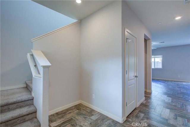 stairway featuring recessed lighting and baseboards