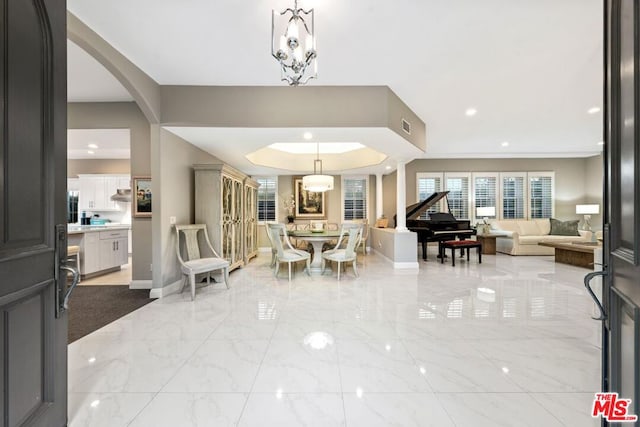 dining area featuring a notable chandelier