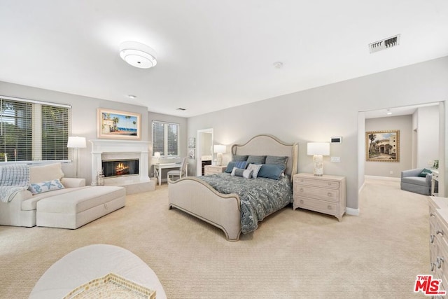 bedroom with light colored carpet