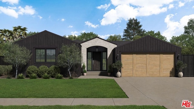 view of front of property featuring a garage and a front yard