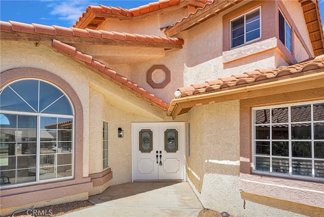 property entrance featuring french doors